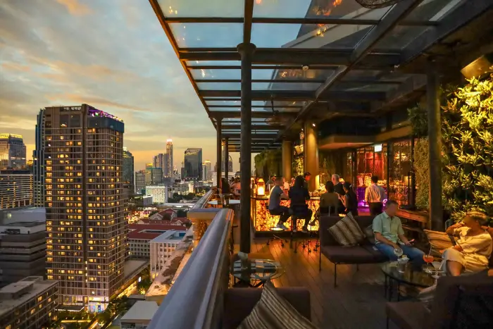 
Evening sets in at the rooftop bar of Hotel Muse Bangkok, where cocktails meet skyline views in one of the top solo-friendly bars in Bangkok. Featured on The Road to Timbuktu, it’s the perfect spot for mature travellers flying solo—no reservation, no judgement, just a damn fine drink with a view.