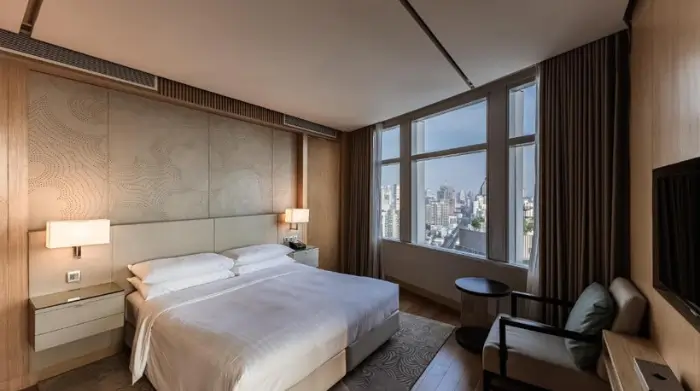 A stylish suite at the Marriott Hotel Sukhumvit, offering skyline views just steps from some of the best rooftop bars in Sukhumvit. Featured on The Road to Timbuktu, this hotel is a top pick for mature solo travellers who enjoy city views with their comfort—and cocktails.