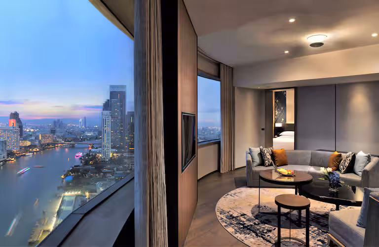 A spacious suite at Hilton Millennium Bangkok with sweeping river views—perfect for independent travel Bangkok style. Featured on The Road to Timbuktu, this elegant escape is ideal for solo travellers over 50 who like their mornings quiet, their coffee strong, and their skyline undisturbed.