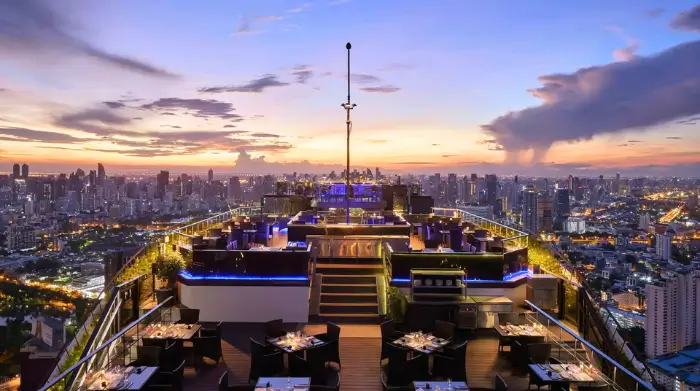 Golden hour at Vertigo rooftop bar in Bangkok, where solo travellers sip cocktails with sweeping skyline views. Featured on The Road to Timbuktu, it’s a top pick for anyone wondering where to drink in Bangkok alone—with style, altitude, and zero awkward bar stool chat required.