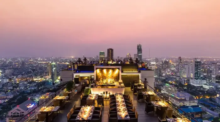 Vertigo and Moon Bar set high above Bangkok, with panoramic sunset views and candlelit tables—one of the most iconic Bangkok rooftop bars. Featured on The Road to Timbuktu, it’s a bucket list spot for mature solo travellers chasing skyline cocktails and a touch of rooftop romance (no date required).