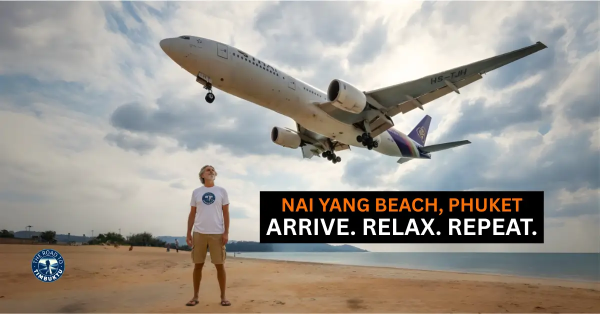 A Thai Airways plane landing over Nai Yang Beach, Phuket, with Peter Kane from The Road to Timbuktu watching below; featured image for the post “Best 3-Star Hotels Near Nai Yang Beach